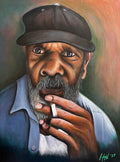 Artistic portrait of a man smoking a cigarette with a blurred background